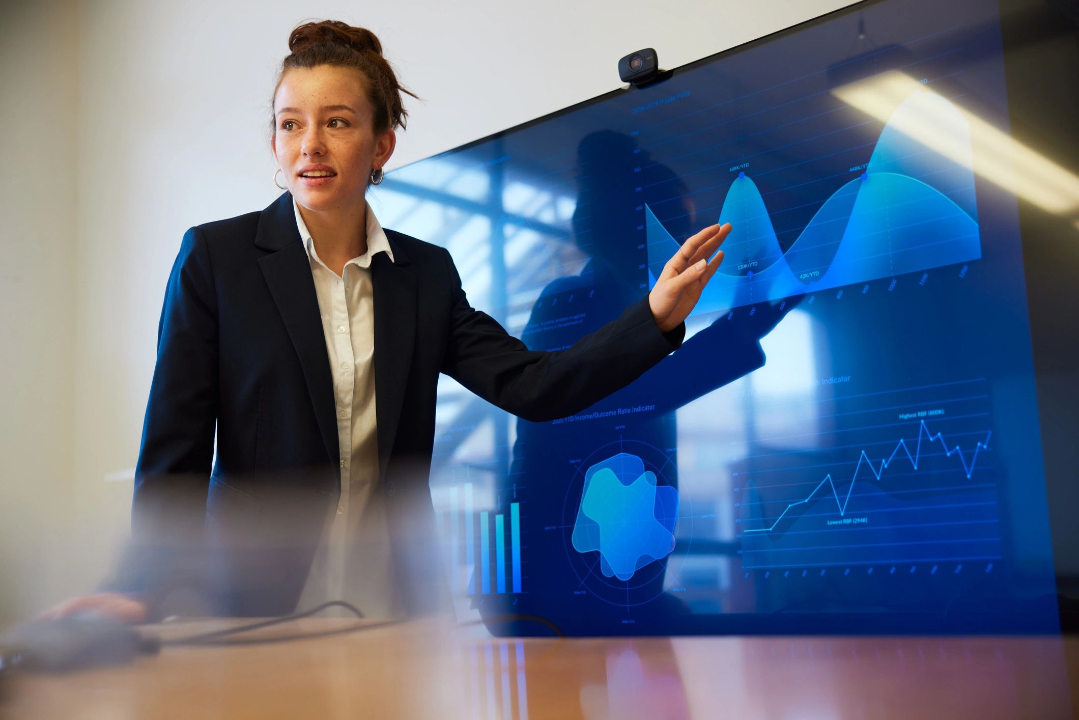Consultant presenting data visuals during a strategy meeting