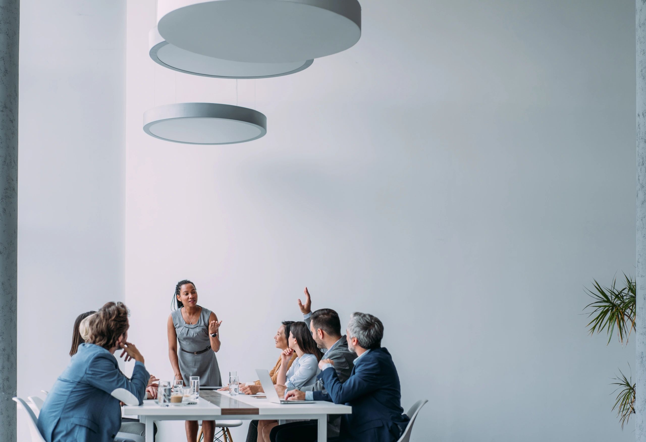 Executive presenting to a leadership team in a boardroom
